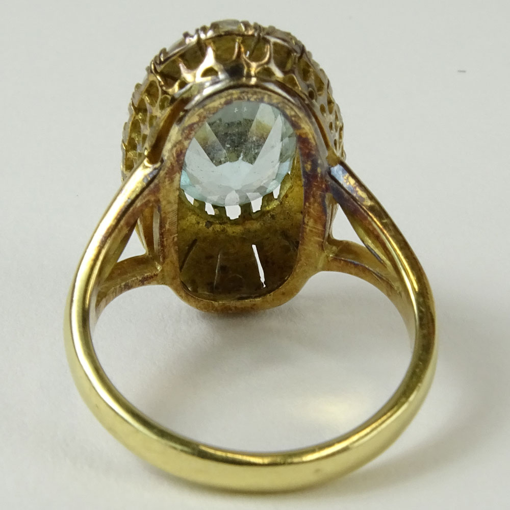 Antique Oval Cut Aquamarine, Rose Cut Diamond and 14 Karat Yellow Gold Ring.