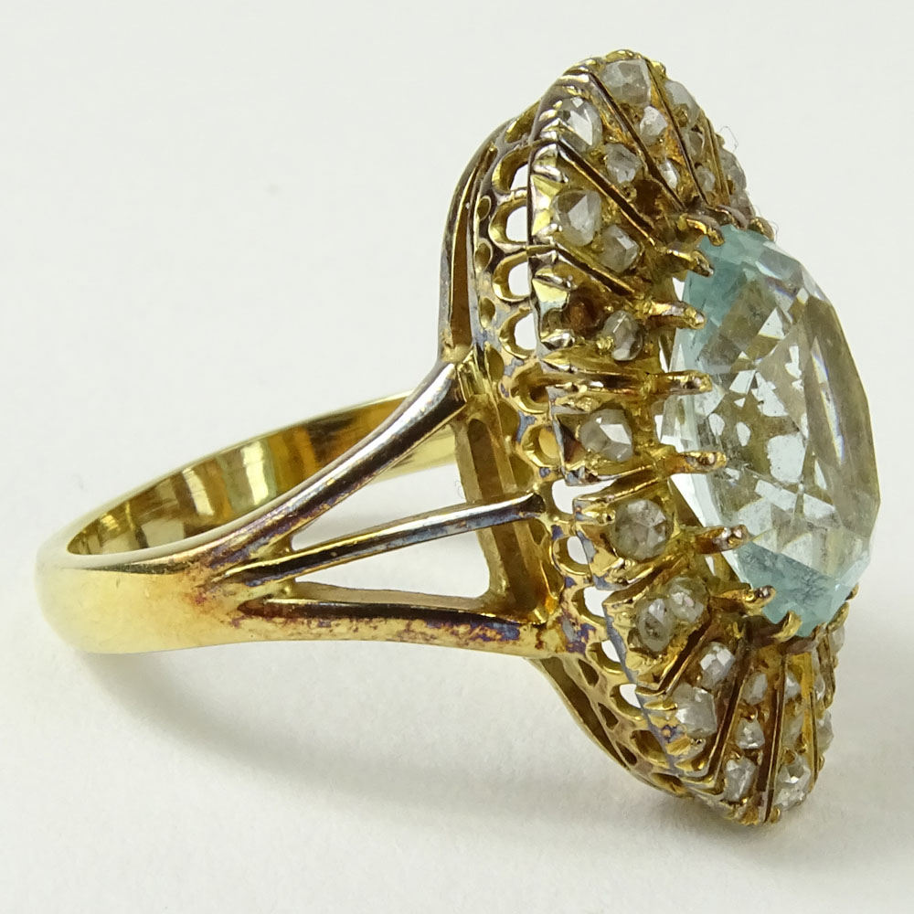 Antique Oval Cut Aquamarine, Rose Cut Diamond and 14 Karat Yellow Gold Ring.