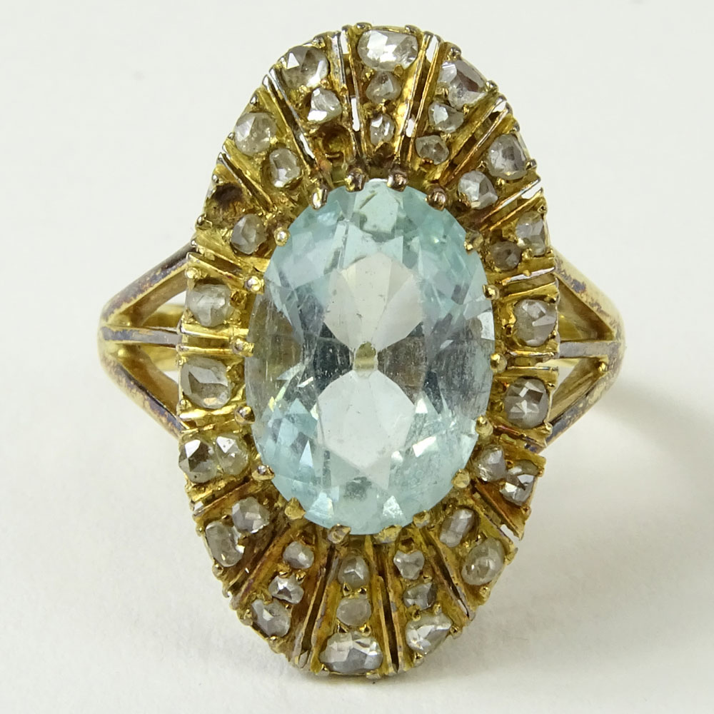 Antique Oval Cut Aquamarine, Rose Cut Diamond and 14 Karat Yellow Gold Ring.