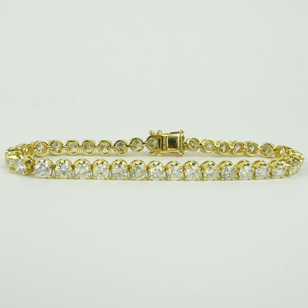 AIG Certified 11.33 Carat Round Cut Diamond and 18 Karat Yellow Gold Tennis Bracelet.