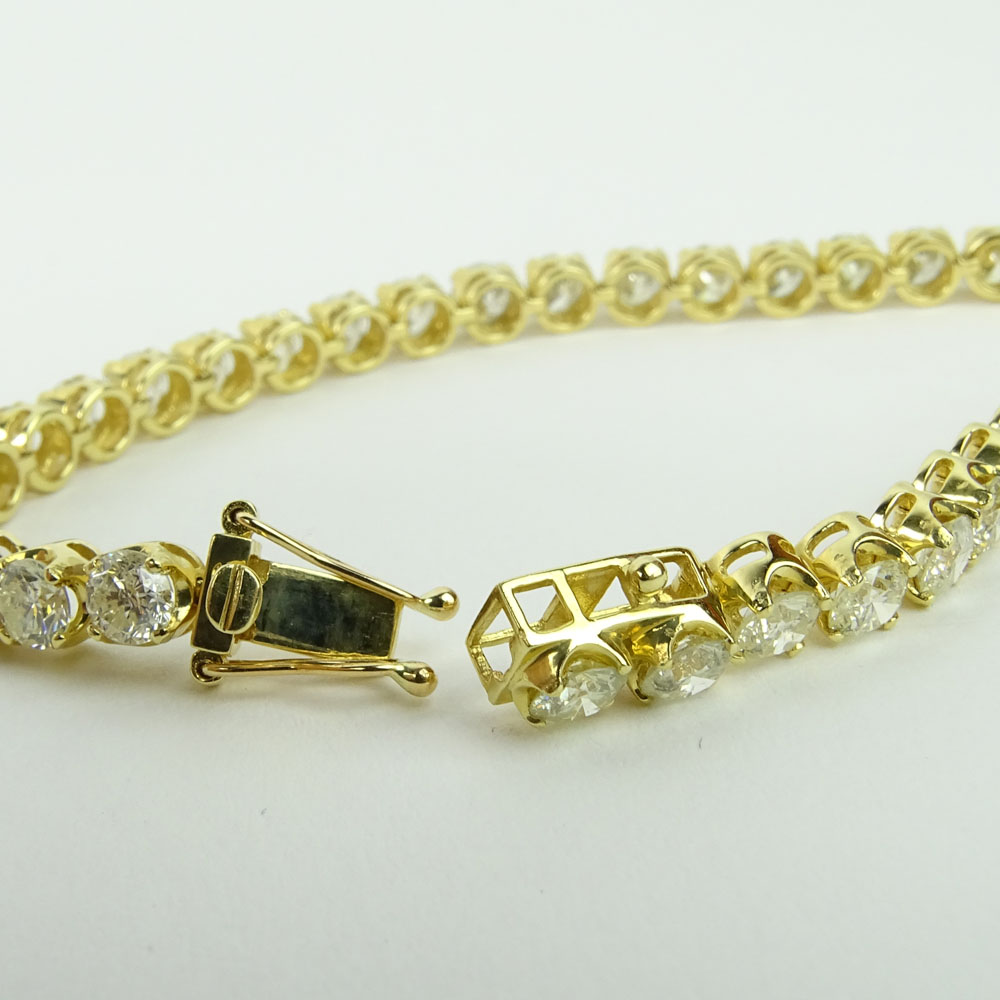 AIG Certified 11.33 Carat Round Cut Diamond and 18 Karat Yellow Gold Tennis Bracelet.