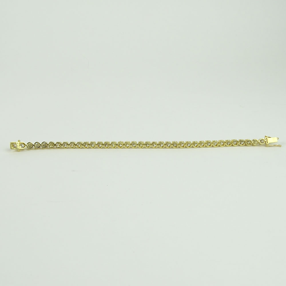 AIG Certified 11.33 Carat Round Cut Diamond and 18 Karat Yellow Gold Tennis Bracelet.