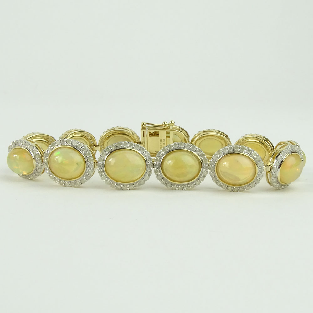 AIG Certified 18.43 Carat Cabochon Opal, 3.25 carat Round Cut Diamond and 14 Karat Yellow Gold Bracelet. 