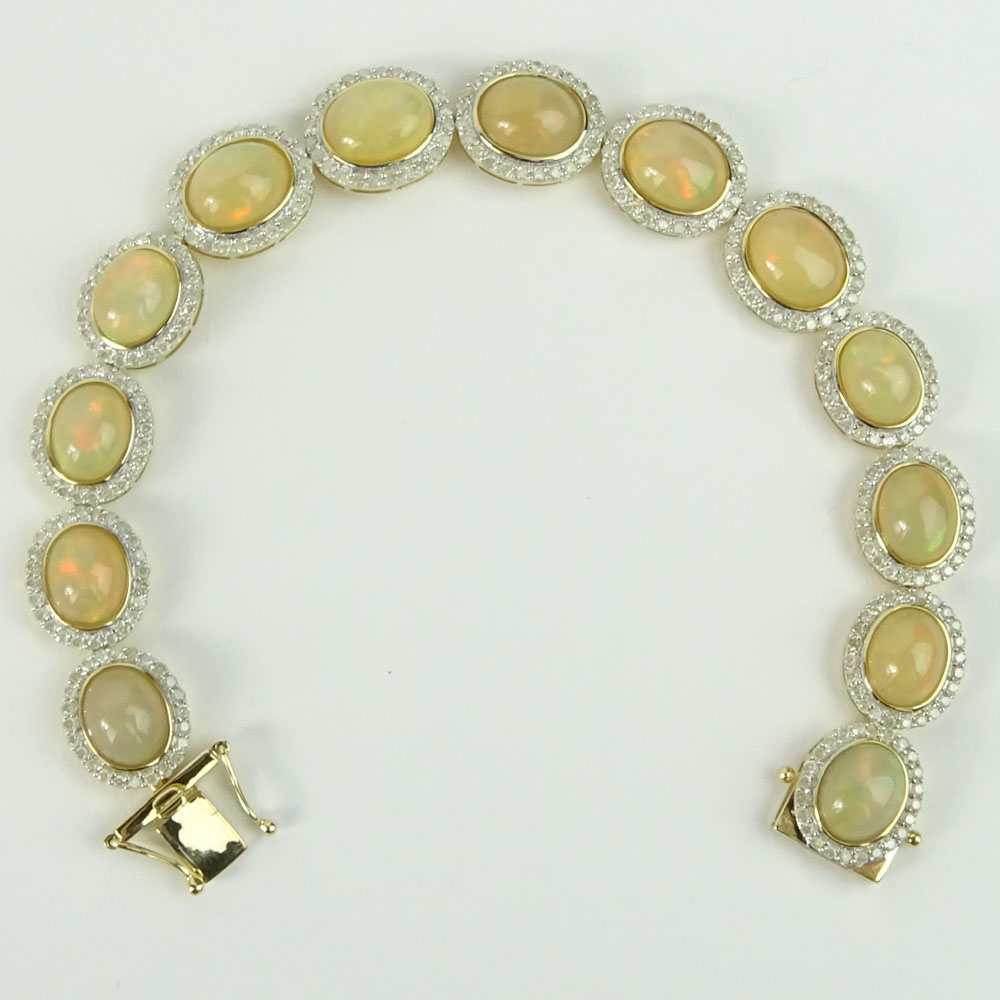 AIG Certified 18.43 Carat Cabochon Opal, 3.25 carat Round Cut Diamond and 14 Karat Yellow Gold Bracelet. 