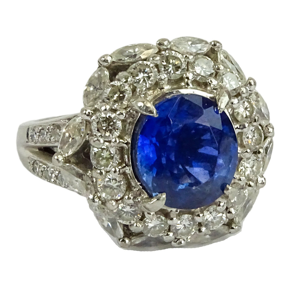 GIA Certified 5.93 Carat Ceylon Sapphire and Round Brilliant Cut and Marquise Cut Diamonds Weighing approximately 3.00 Carats Mounted in an Italian Platinum Lady's Ring.