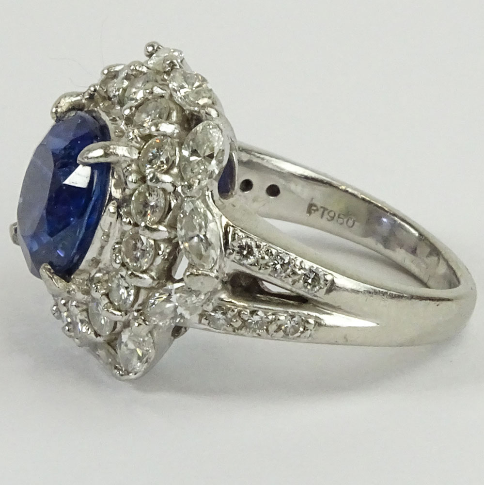 GIA Certified 5.93 Carat Ceylon Sapphire and Round Brilliant Cut and Marquise Cut Diamonds Weighing approximately 3.00 Carats Mounted in an Italian Platinum Lady's Ring.