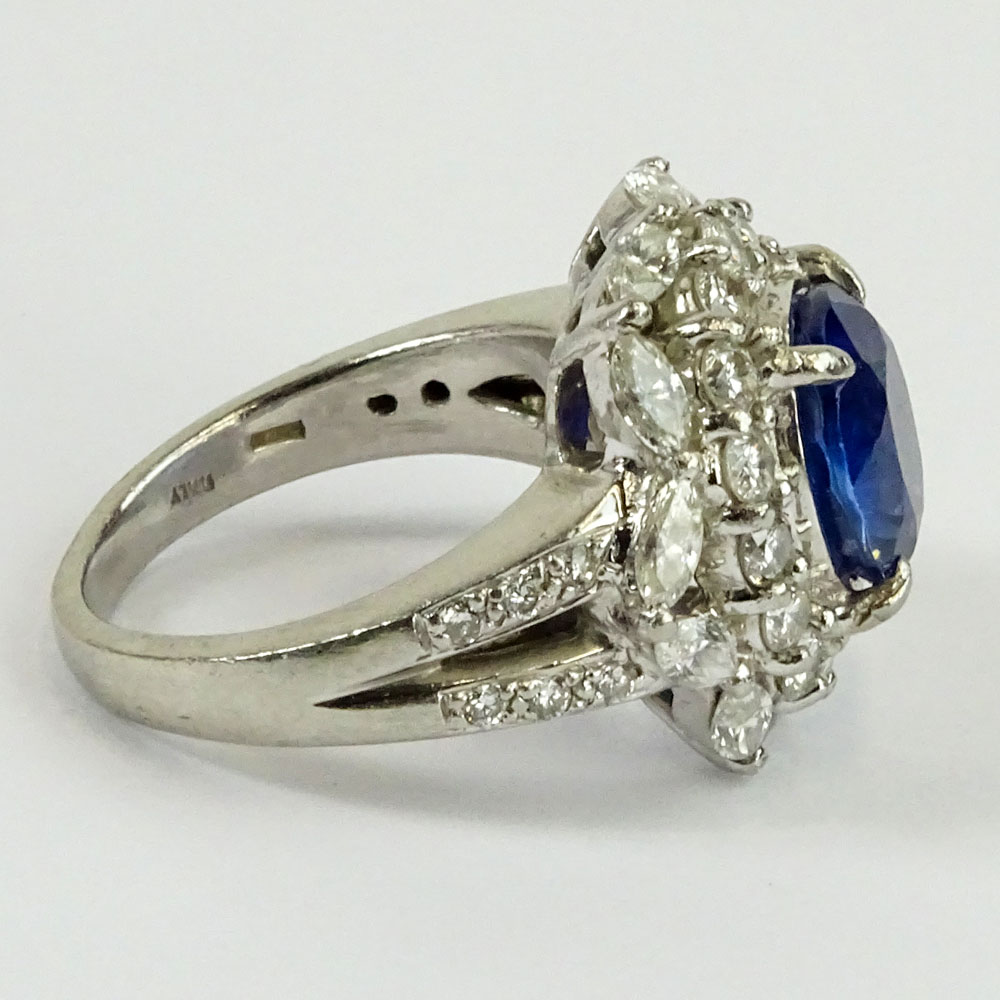 GIA Certified 5.93 Carat Ceylon Sapphire and Round Brilliant Cut and Marquise Cut Diamonds Weighing approximately 3.00 Carats Mounted in an Italian Platinum Lady's Ring.