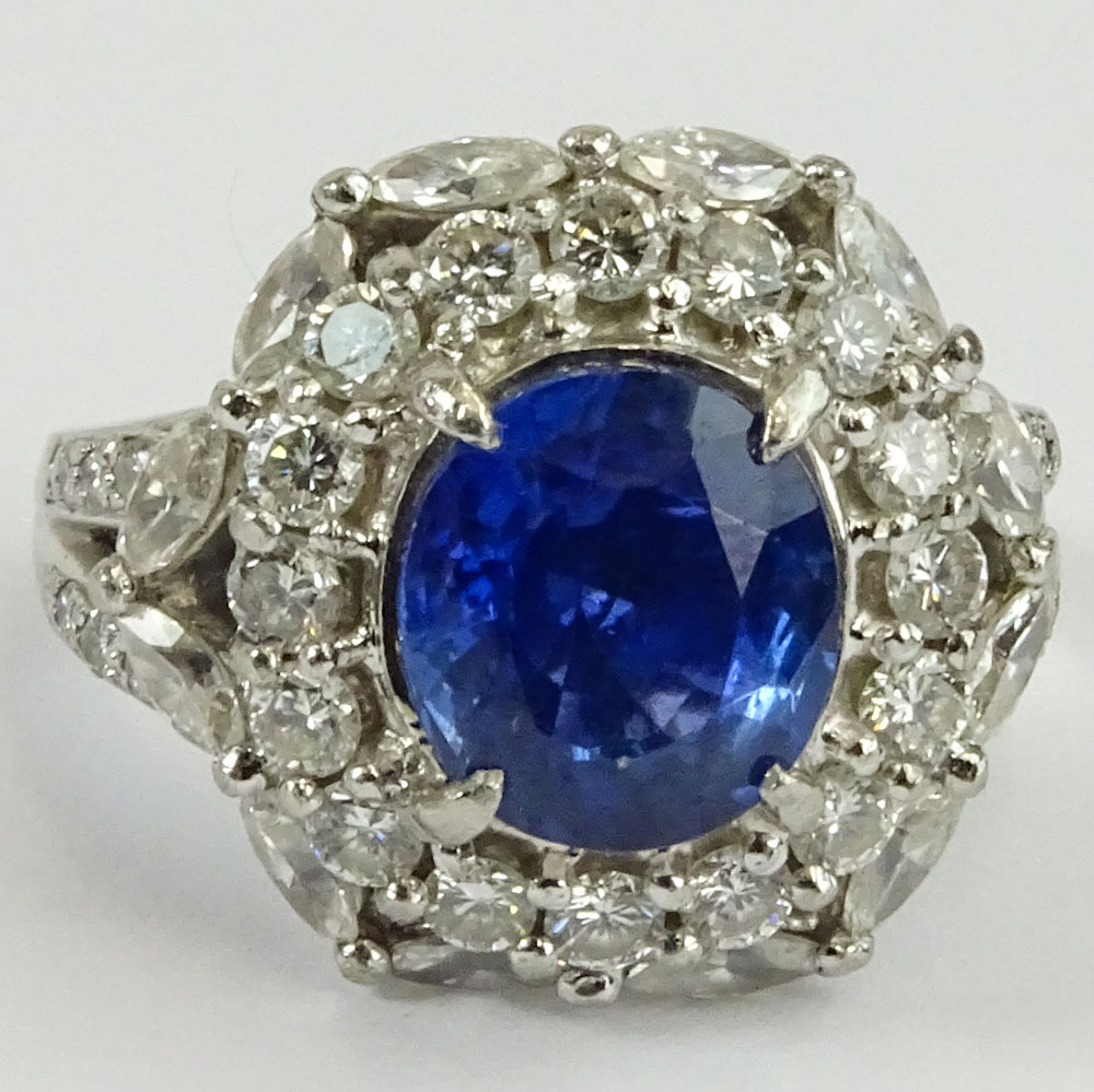 GIA Certified 5.93 Carat Ceylon Sapphire and Round Brilliant Cut and Marquise Cut Diamonds Weighing approximately 3.00 Carats Mounted in an Italian Platinum Lady's Ring.