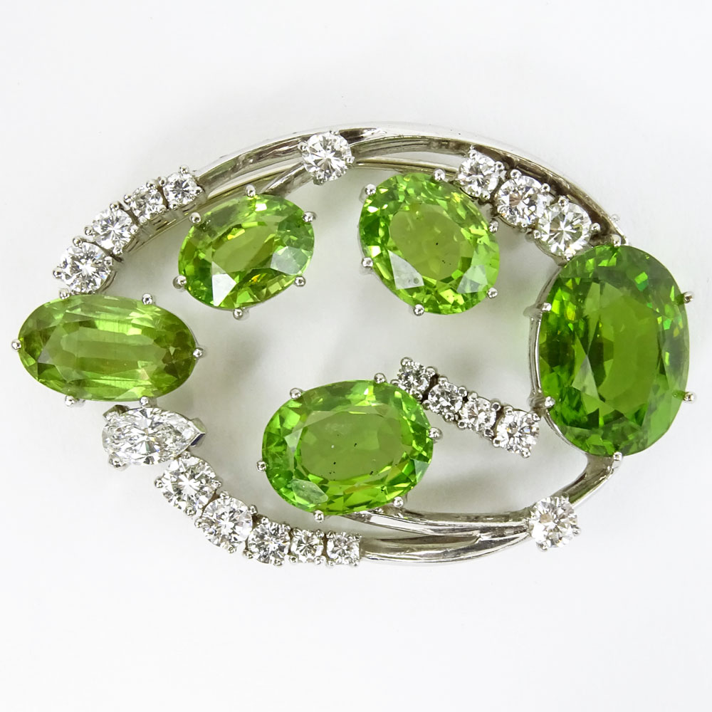 Vintage 2.0-2.25 Carat Diamond, Peridot and 14 Karat White Gold Brooch.