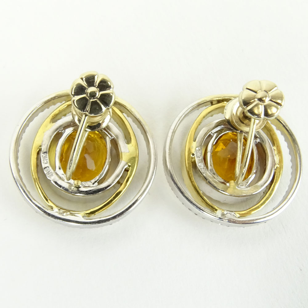 Pair of Oval Cut Citrine and 18 Karat Yellow and White Gold Earrings.