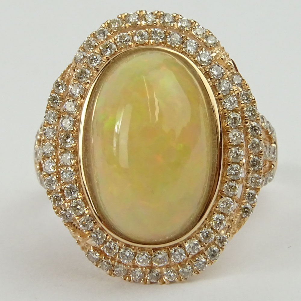 5.0 Carat Cabochon Opal, .88 Carat Round Cut Diamond and 14 Karat Rose Gold Ring.