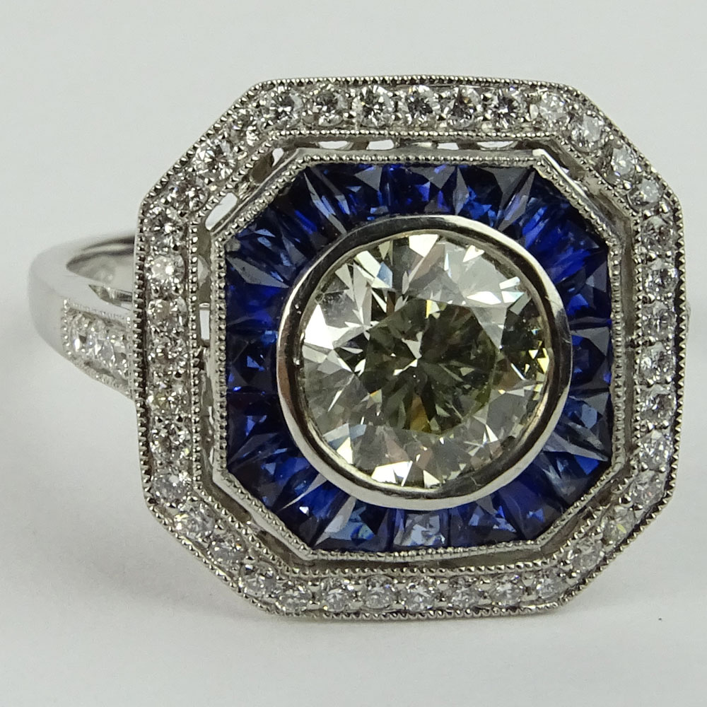 Lady's Approx. 1.35 Carat Round Brilliant Cut Diamond, .85 Carat Sapphire and Platinum Ring accented with .35 Carat Round Brilliant Cut Diamonds