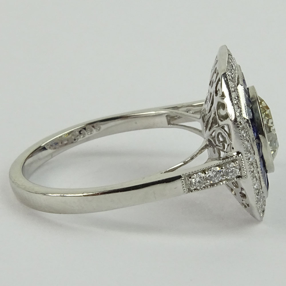 Lady's Approx. 1.35 Carat Round Brilliant Cut Diamond, .85 Carat Sapphire and Platinum Ring accented with .35 Carat Round Brilliant Cut Diamonds