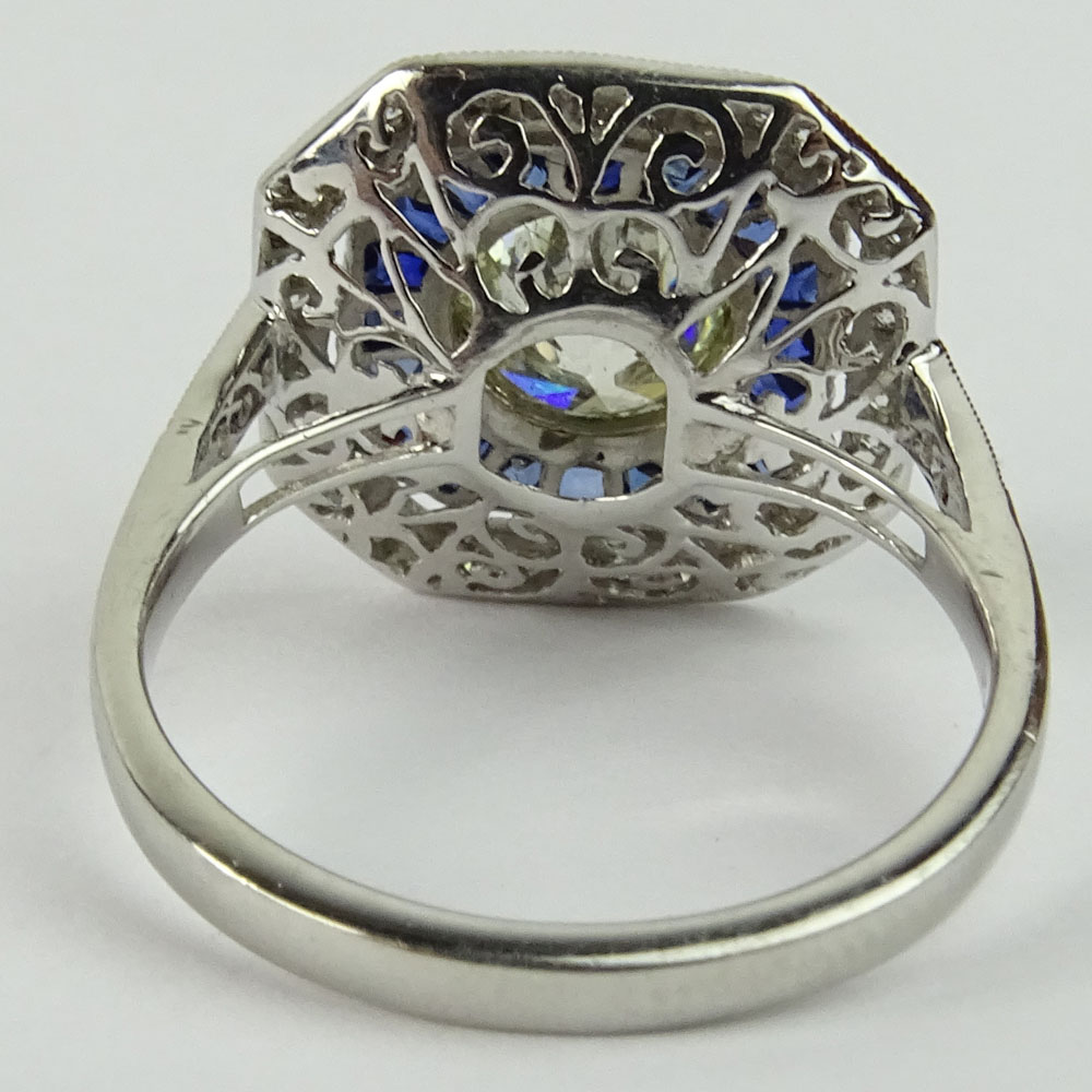 Lady's Approx. 1.35 Carat Round Brilliant Cut Diamond, .85 Carat Sapphire and Platinum Ring accented with .35 Carat Round Brilliant Cut Diamonds