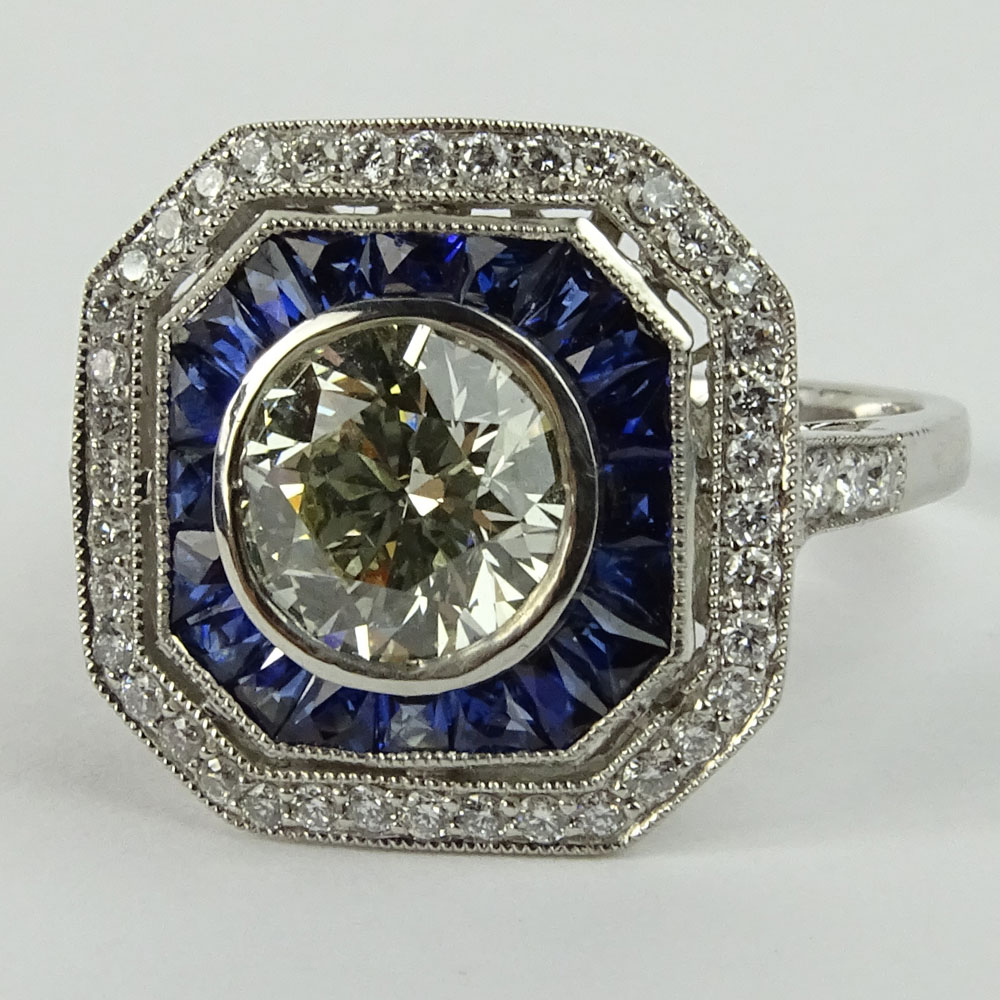 Lady's Approx. 1.35 Carat Round Brilliant Cut Diamond, .85 Carat Sapphire and Platinum Ring accented with .35 Carat Round Brilliant Cut Diamonds