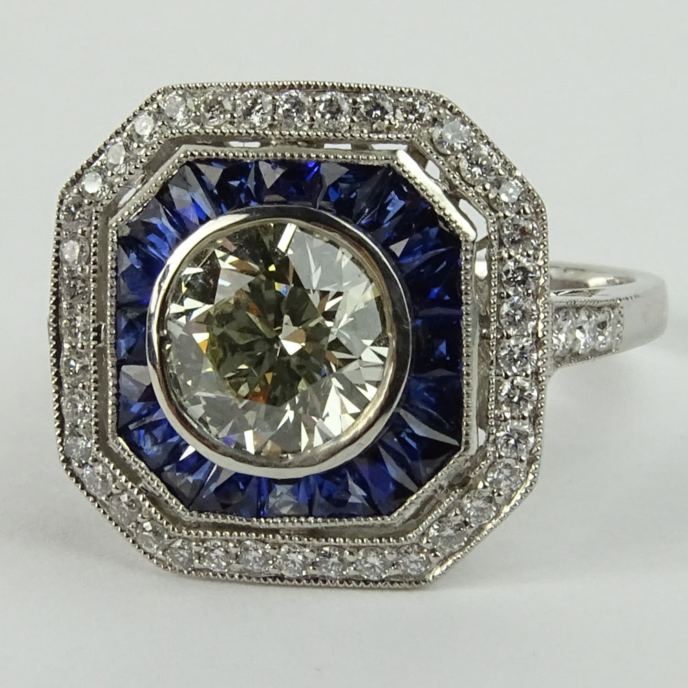 Lady's Approx. 1.35 Carat Round Brilliant Cut Diamond, .85 Carat Sapphire and Platinum Ring accented with .35 Carat Round Brilliant Cut Diamonds