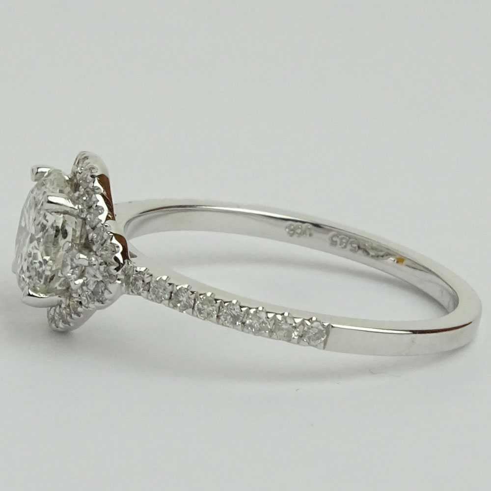 AIG Certified 1.04 Carat Round Brilliant Cut Diamond and 14 Karat White Gold Engagement Ring accented with .27 Carat Round Brilliant Cut Diamonds.