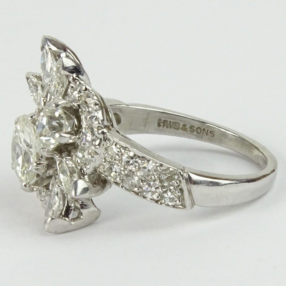 Lady's Vintage Diamond and 18 Karat White Gold Cluster Ring with Center Approx. .90 Carat Round Cut Diamond.