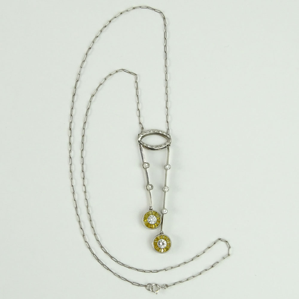 Diamond, Yellow Sapphire and 14 Karat White Gold Necklace.