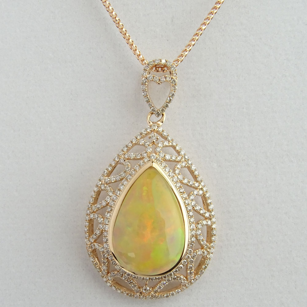 AIG Certified 9.45 Carat Pear Shape Opal, 1.27 Carat Round Cut Diamond and 14 Karat Rose Gold Pendant Necklace. 