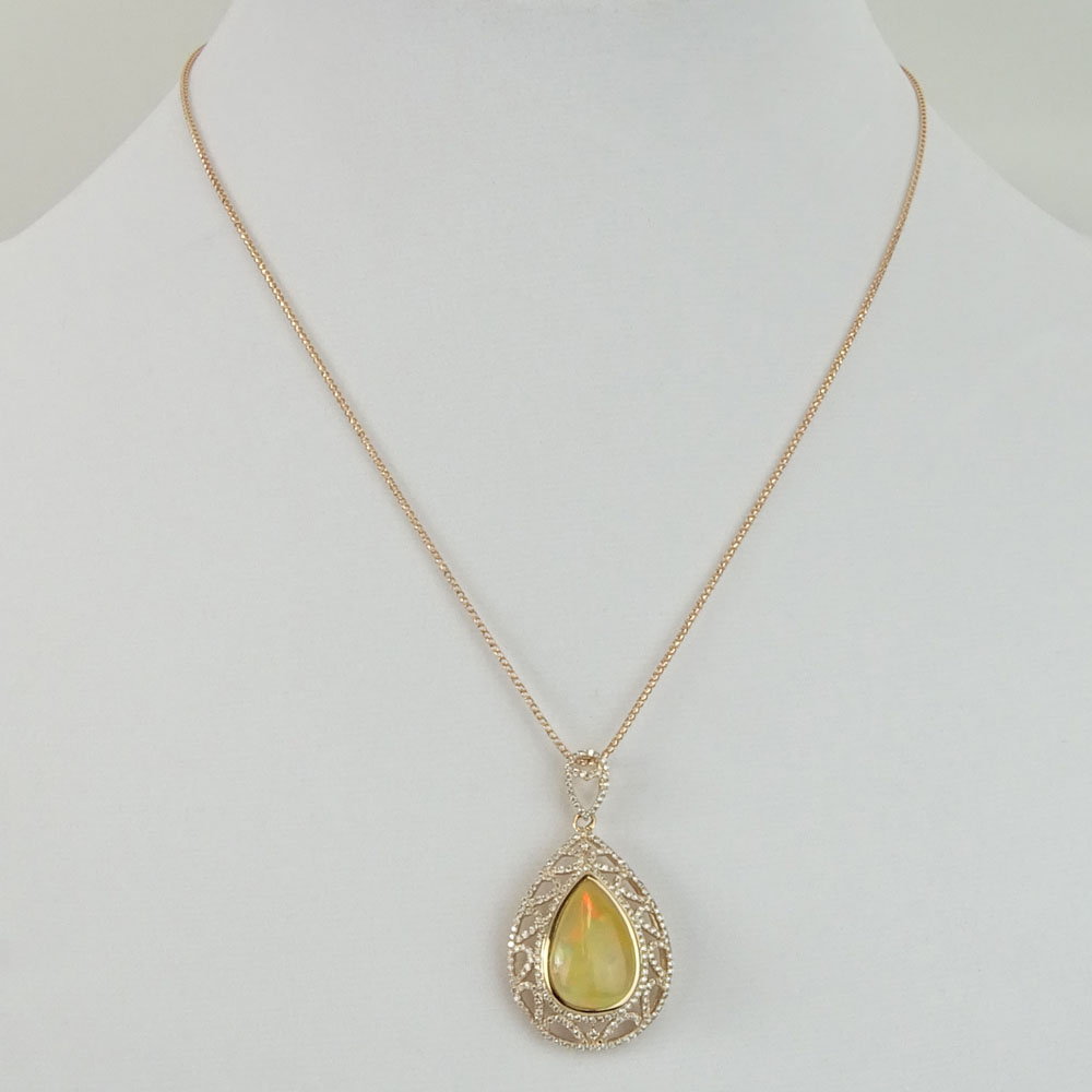 AIG Certified 9.45 Carat Pear Shape Opal, 1.27 Carat Round Cut Diamond and 14 Karat Rose Gold Pendant Necklace. 