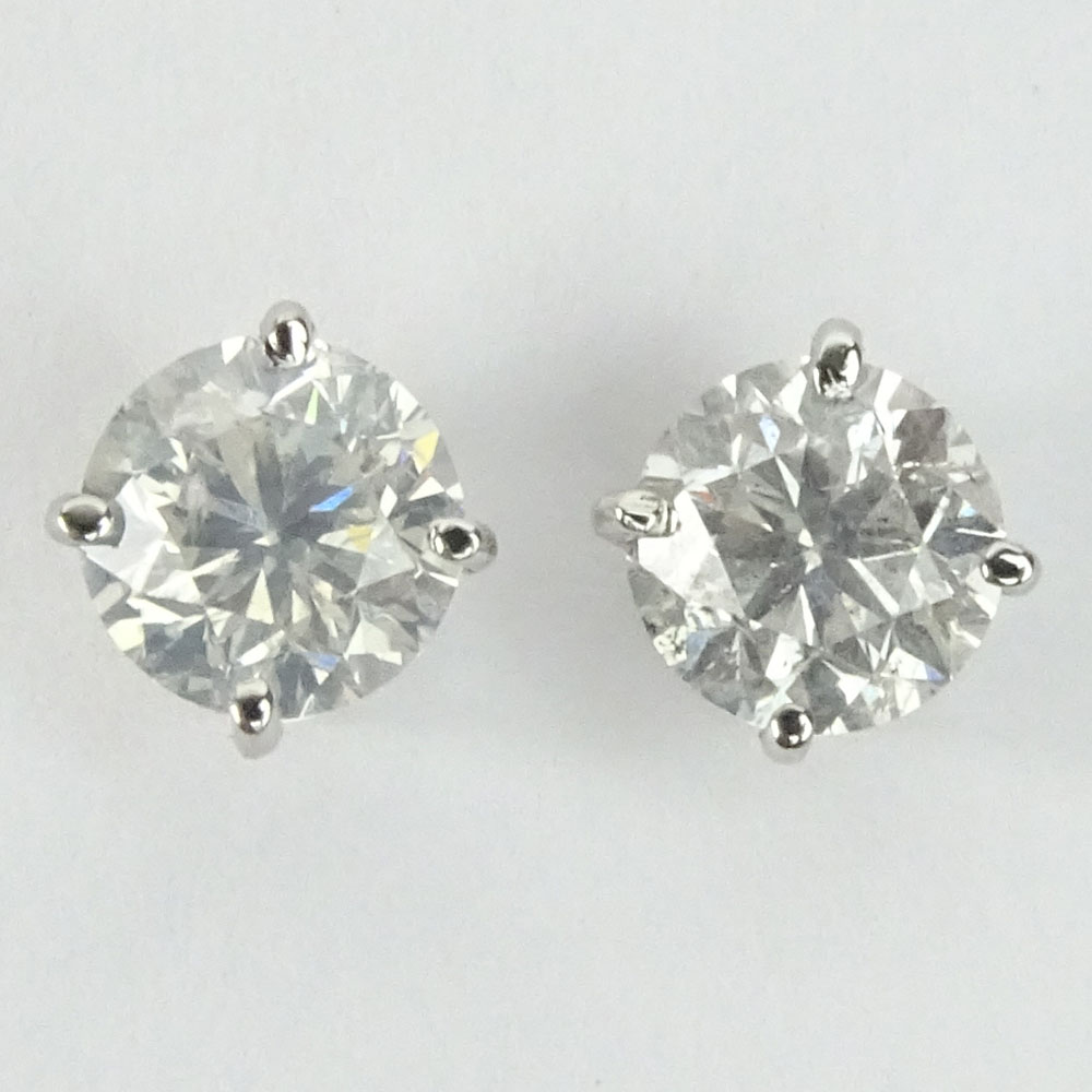 AIG Certified 1.97 Carat Total Weight Round Cut Diamond and 14 Karat White Gold Ear Studs.