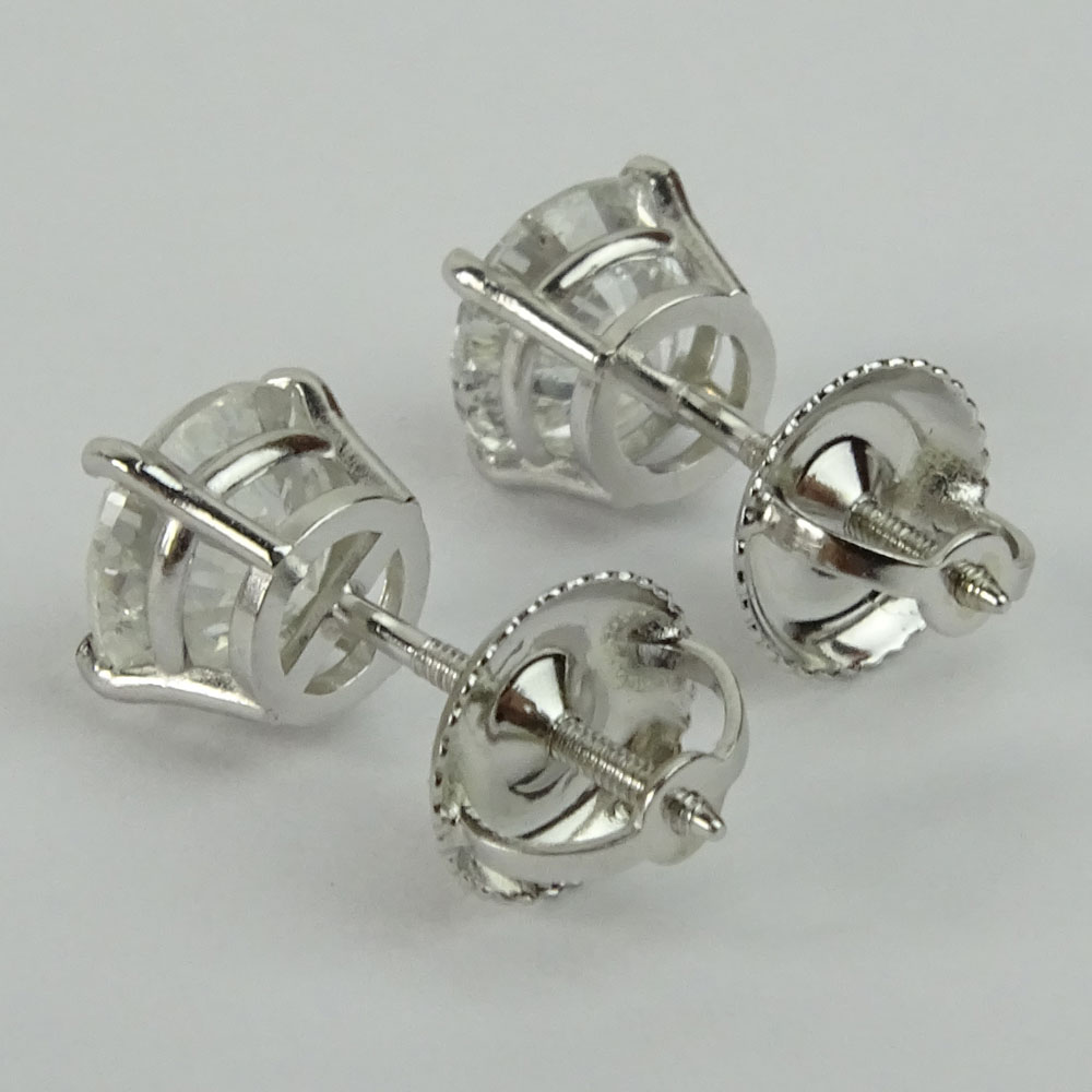 AIG Certified 1.97 Carat Total Weight Round Cut Diamond and 14 Karat White Gold Ear Studs.