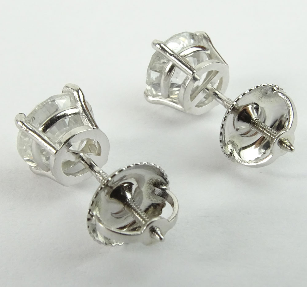 AIG Certified 1.97 Carat Total Weight Round Cut Diamond and 14 Karat White Gold Ear Studs.