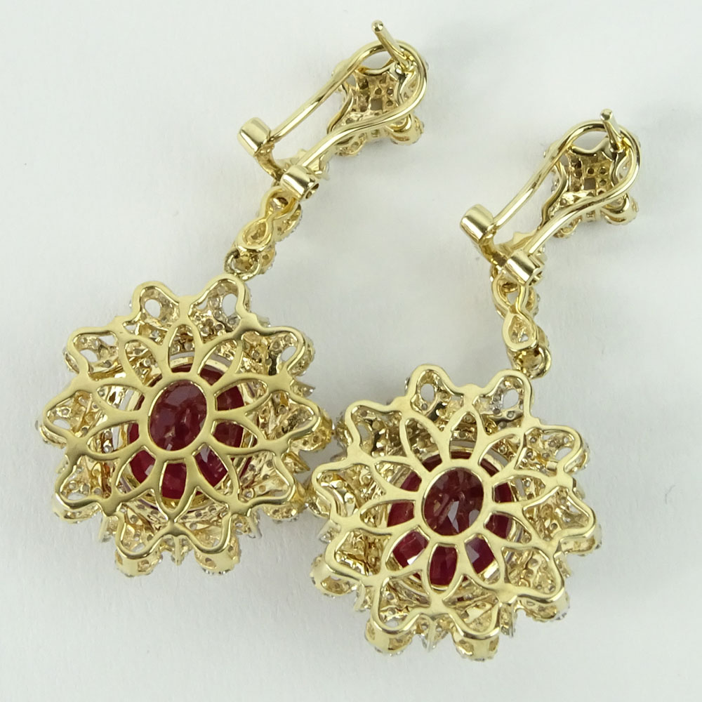 GGA Certified 13.74 Carat Oval Cut Ruby, 1.84 Carat Round Cut Diamond and 14 Karat Yellow Gold Earrings. 