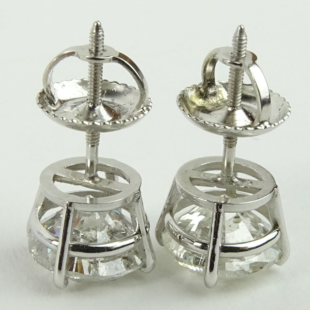 AIG Certified 3.17 Carat Total Weight Round Cut Diamond and 14 Karat White Gold Ear Studs.