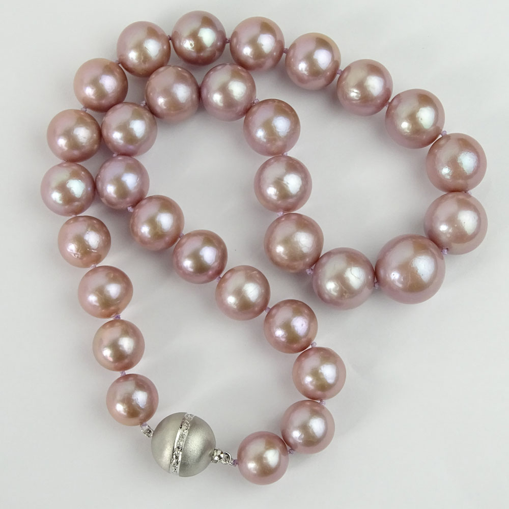 Single Strand Graduated Lavender Pearl Necklace with 14 Karat White Gold Clasp.