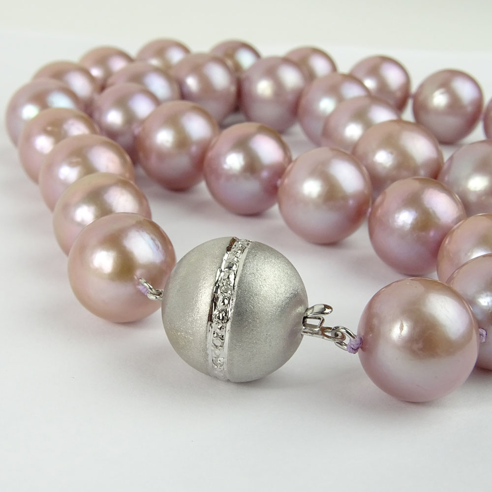 Single Strand Graduated Lavender Pearl Necklace with 14 Karat White Gold Clasp.