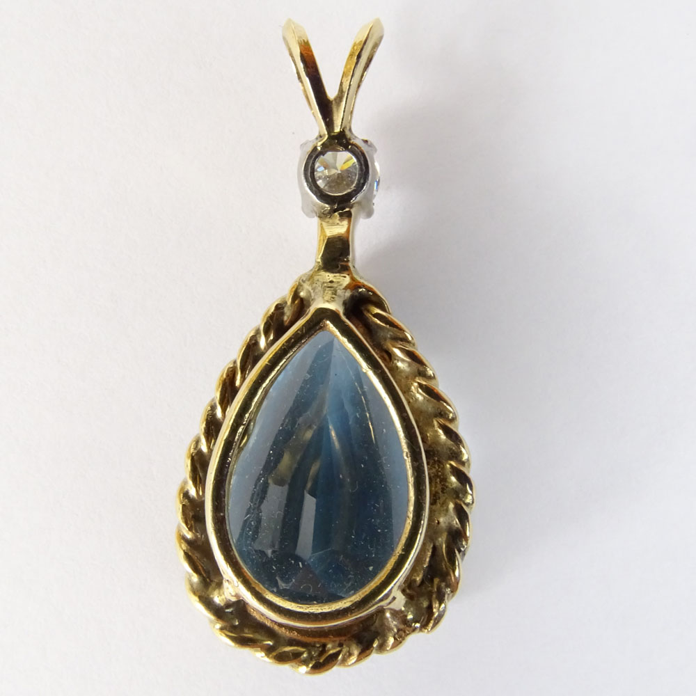 Vintage Pear Shaped Blue Topaz, approx. .25 Carat Diamond  and 14 Karat Yellow Gold Pendant.