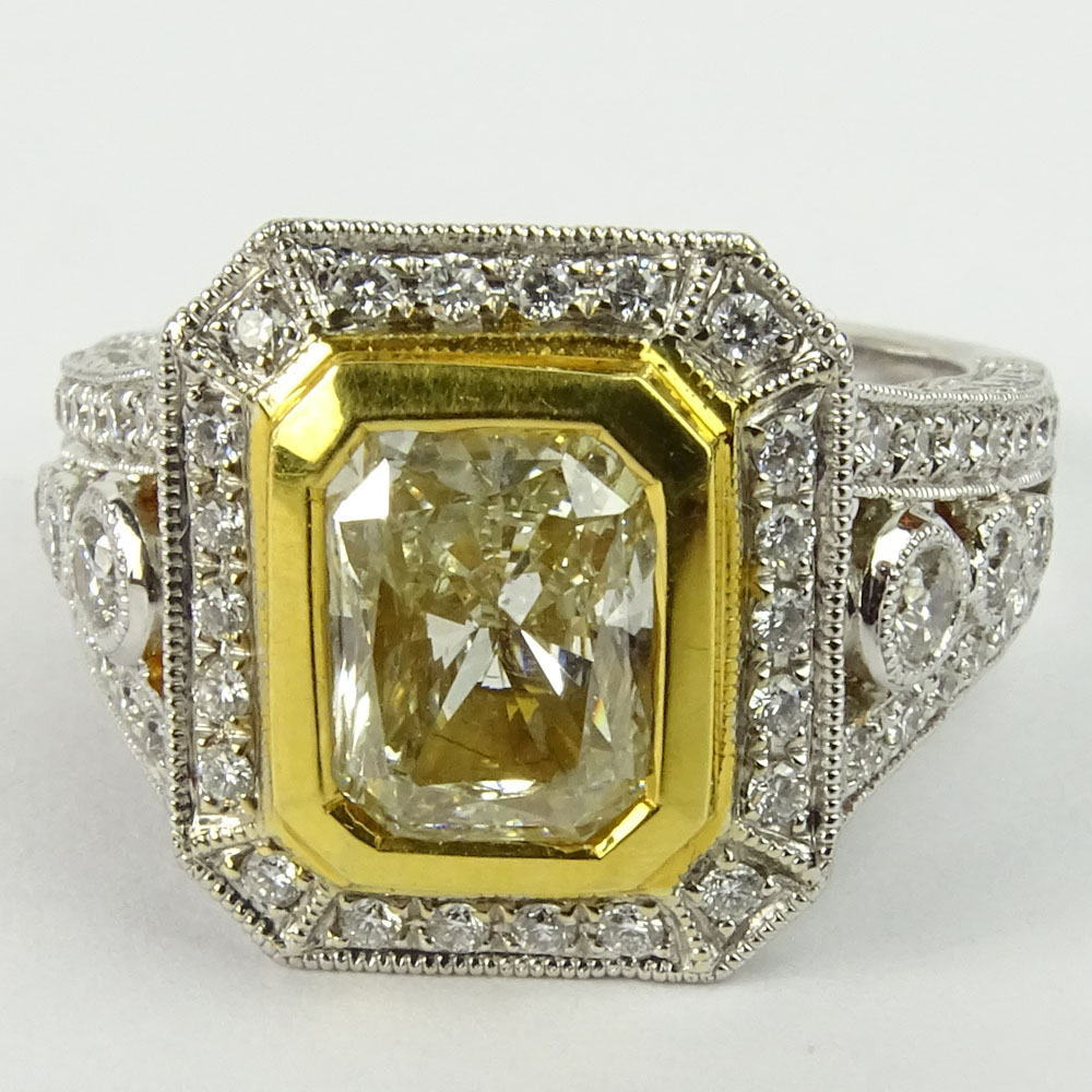 Approx. 1.75 Carat Radiant Cut Fancy Yellow Diamond and 18 Karat White and Yellow Gold Engagement Ring.B210