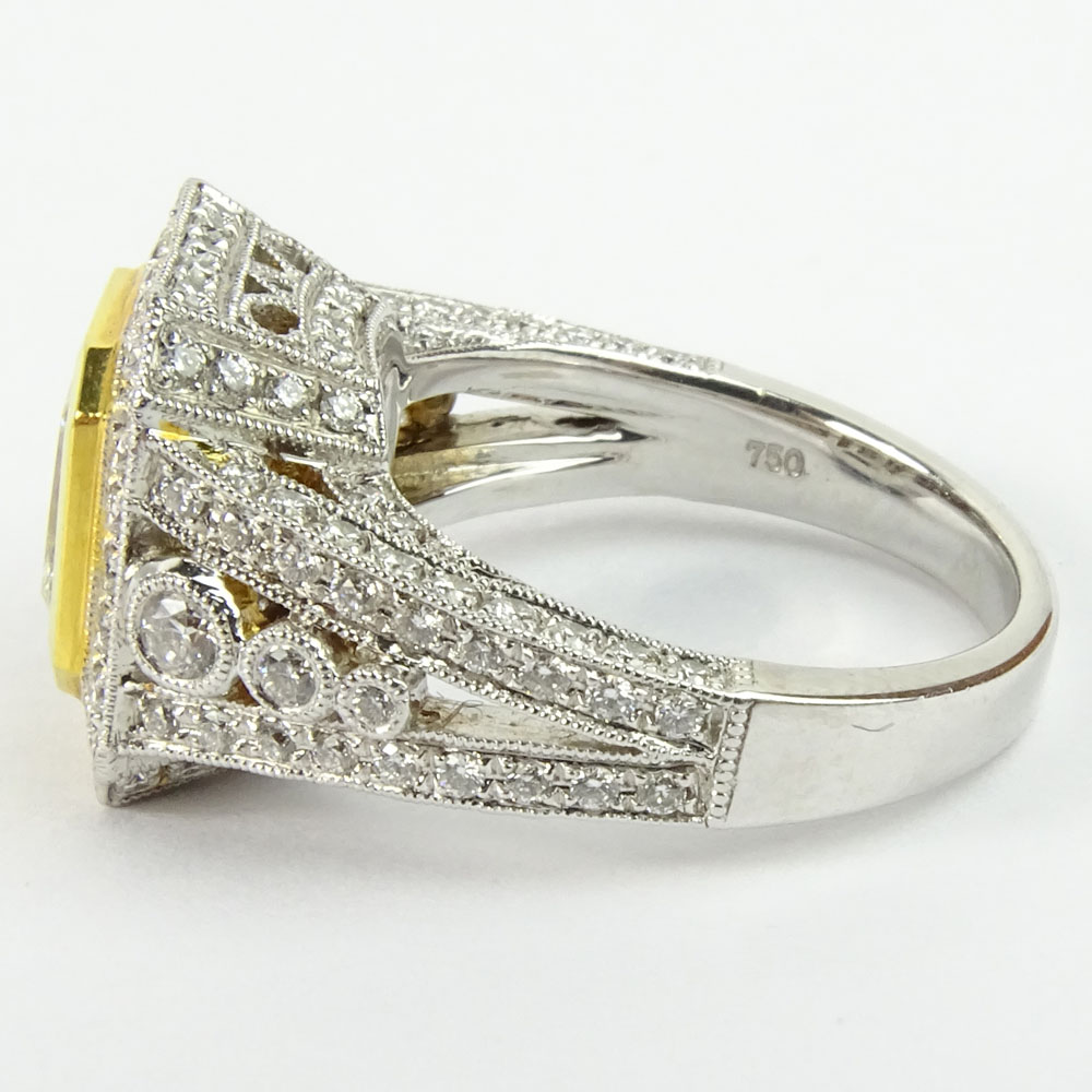 Approx. 1.75 Carat Radiant Cut Fancy Yellow Diamond and 18 Karat White and Yellow Gold Engagement Ring.B210