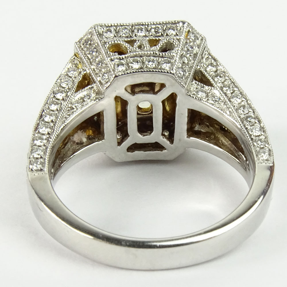 Approx. 1.75 Carat Radiant Cut Fancy Yellow Diamond and 18 Karat White and Yellow Gold Engagement Ring.B210