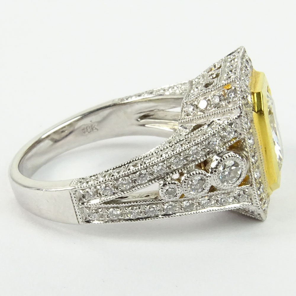 Approx. 1.75 Carat Radiant Cut Fancy Yellow Diamond and 18 Karat White and Yellow Gold Engagement Ring.B210