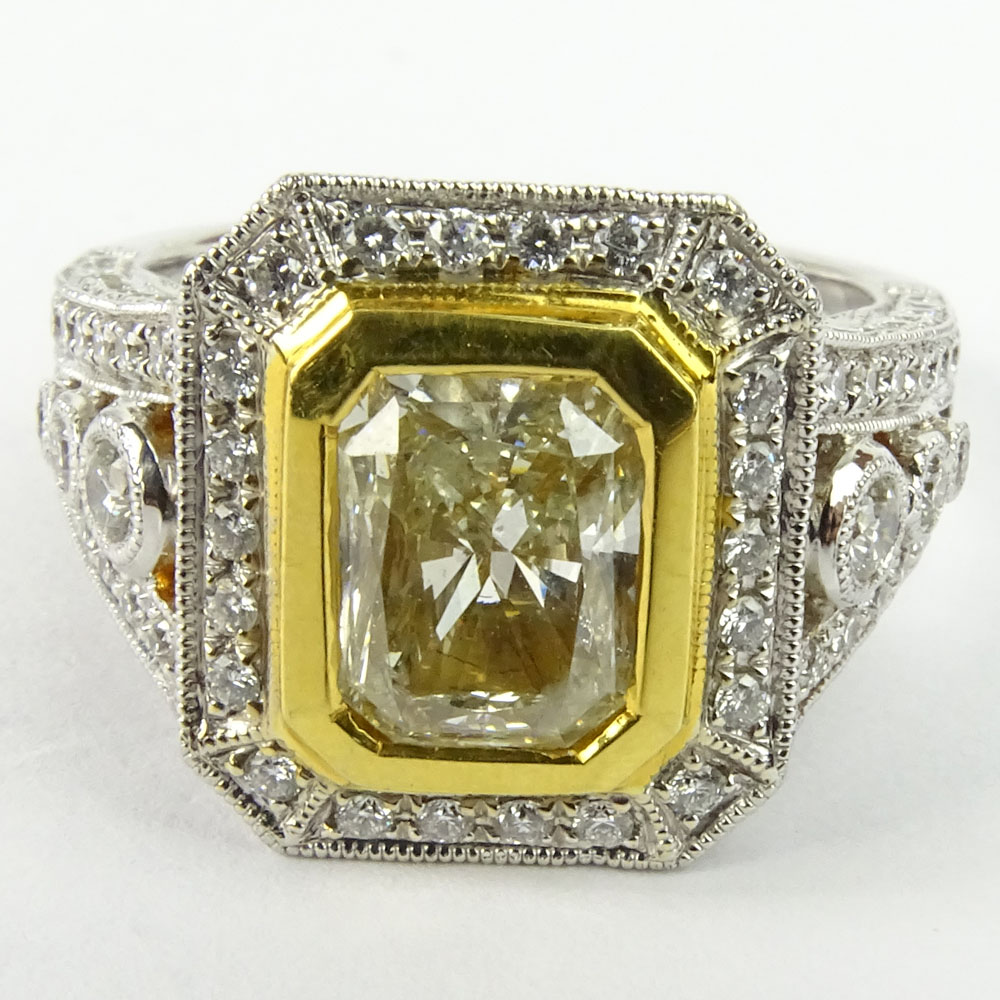 Approx. 1.75 Carat Radiant Cut Fancy Yellow Diamond and 18 Karat White and Yellow Gold Engagement Ring.B210