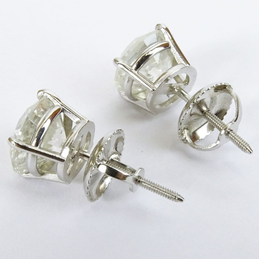 AIG Certified 2.77 Carat Total Weight Round Cut Diamond and 14 Karat White Gold Ear Studs.