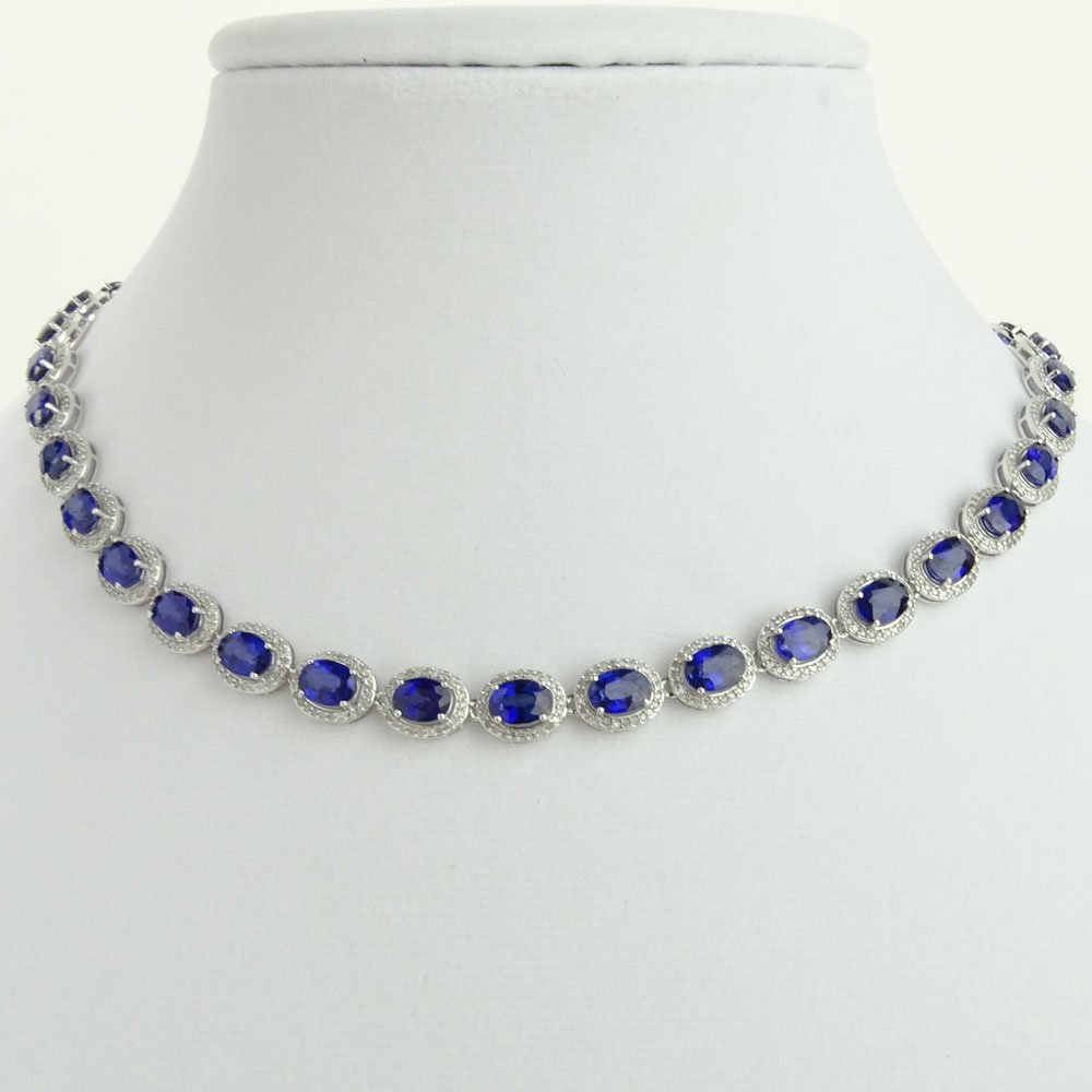 AIG Certified 37.95 Carat Oval Cut Sapphire, 3.93 Carat Round Cut Diamond and 14 Karat White Gold Necklace.