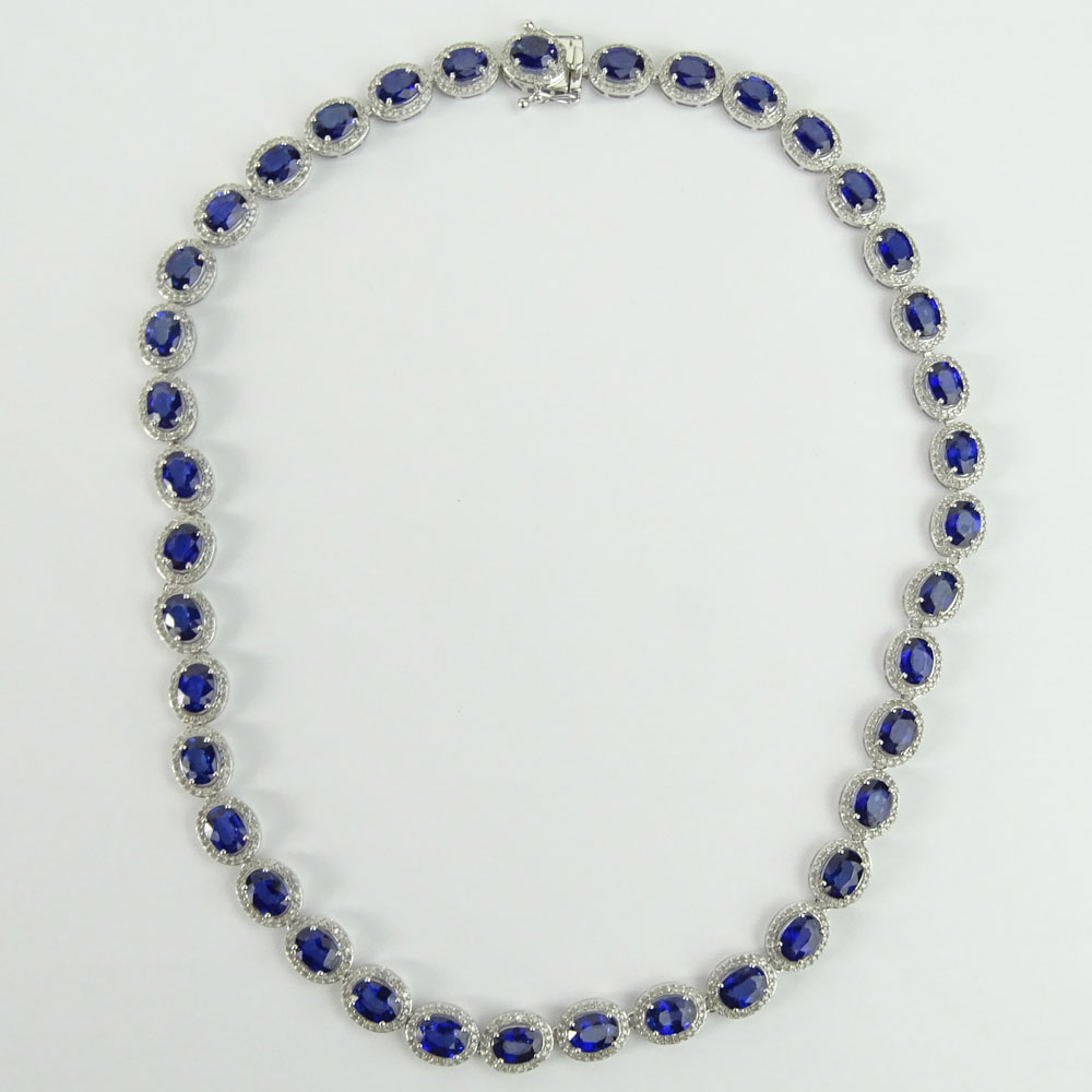 AIG Certified 37.95 Carat Oval Cut Sapphire, 3.93 Carat Round Cut Diamond and 14 Karat White Gold Necklace.