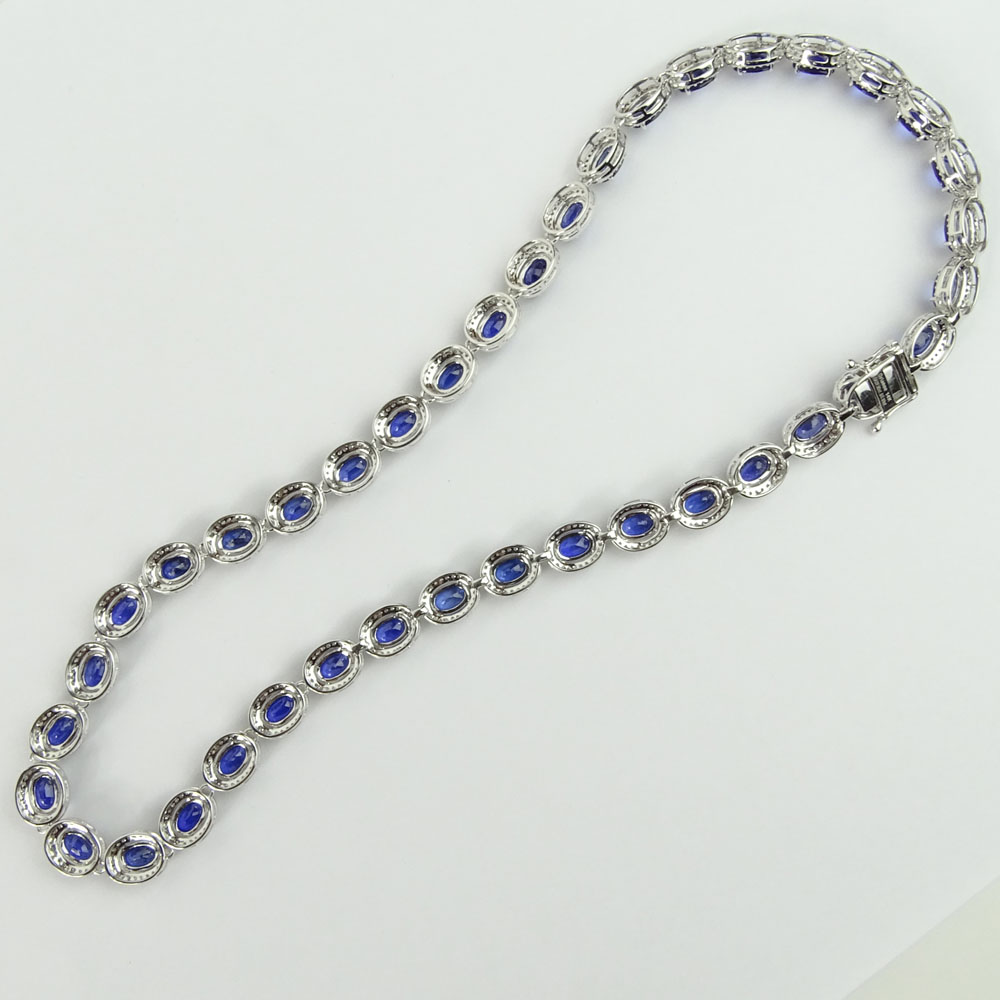 AIG Certified 37.95 Carat Oval Cut Sapphire, 3.93 Carat Round Cut Diamond and 14 Karat White Gold Necklace.