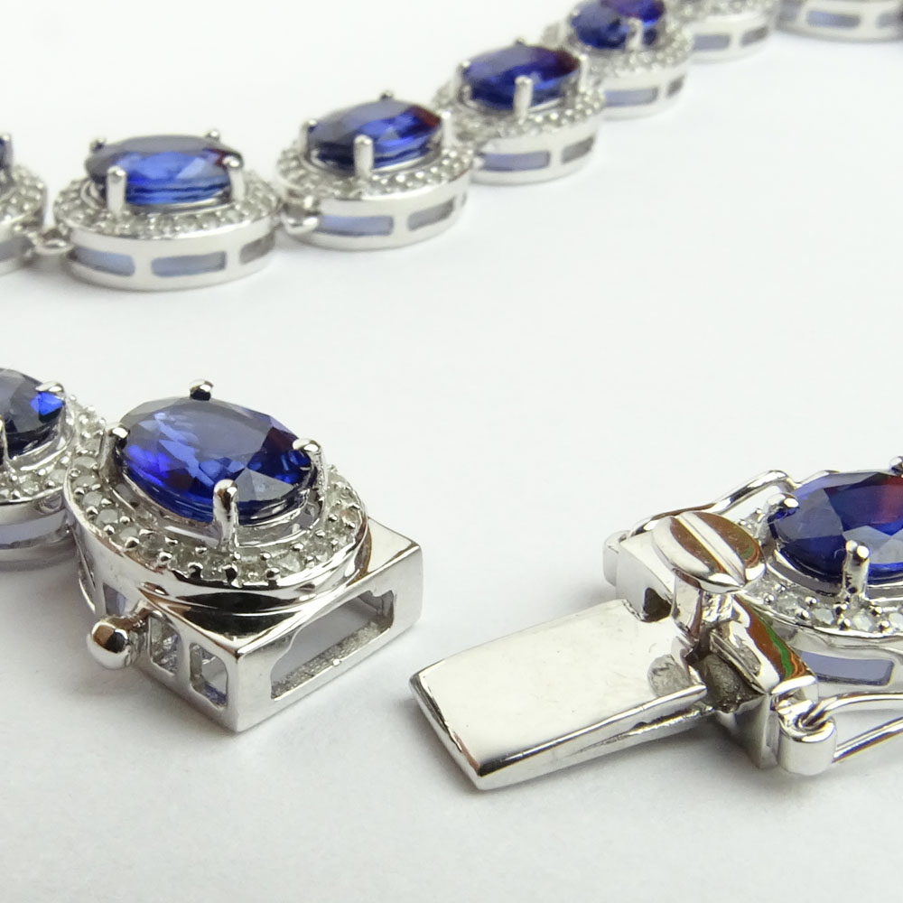 AIG Certified 37.95 Carat Oval Cut Sapphire, 3.93 Carat Round Cut Diamond and 14 Karat White Gold Necklace.