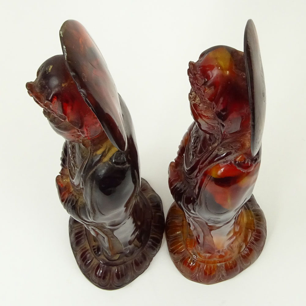 Pair of Vintage Carved Amber Deity Figurines.