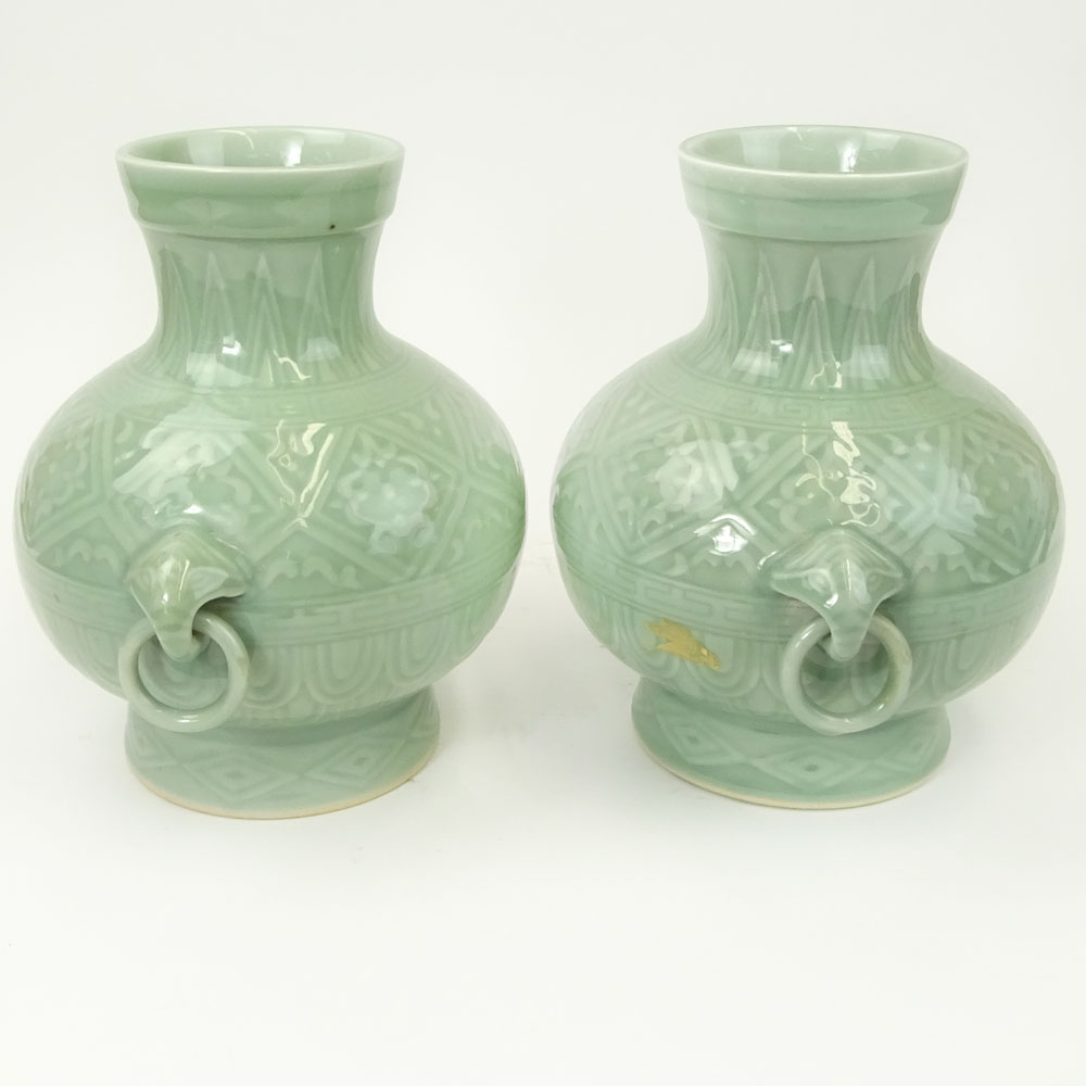 Pair of 2 Contemporary Korean Style Porcelain Figural Ring Handled Vases.