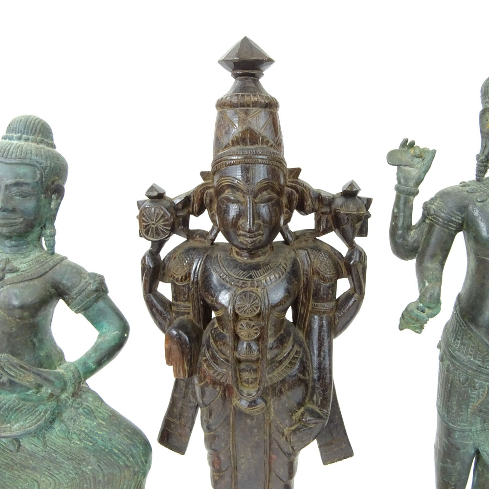 Pair of Modern Tibetan Style Cast Metal Figures on Wood Stands Together with a Carved Wood Figurine.