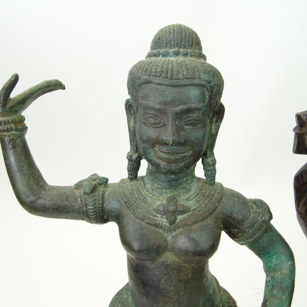 Pair of Modern Tibetan Style Cast Metal Figures on Wood Stands Together with a Carved Wood Figurine.