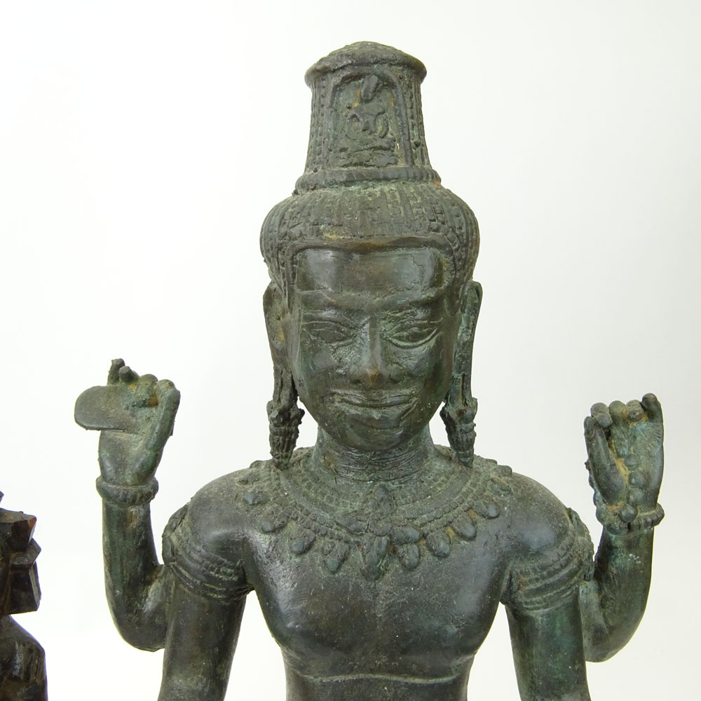 Pair of Modern Tibetan Style Cast Metal Figures on Wood Stands Together with a Carved Wood Figurine.