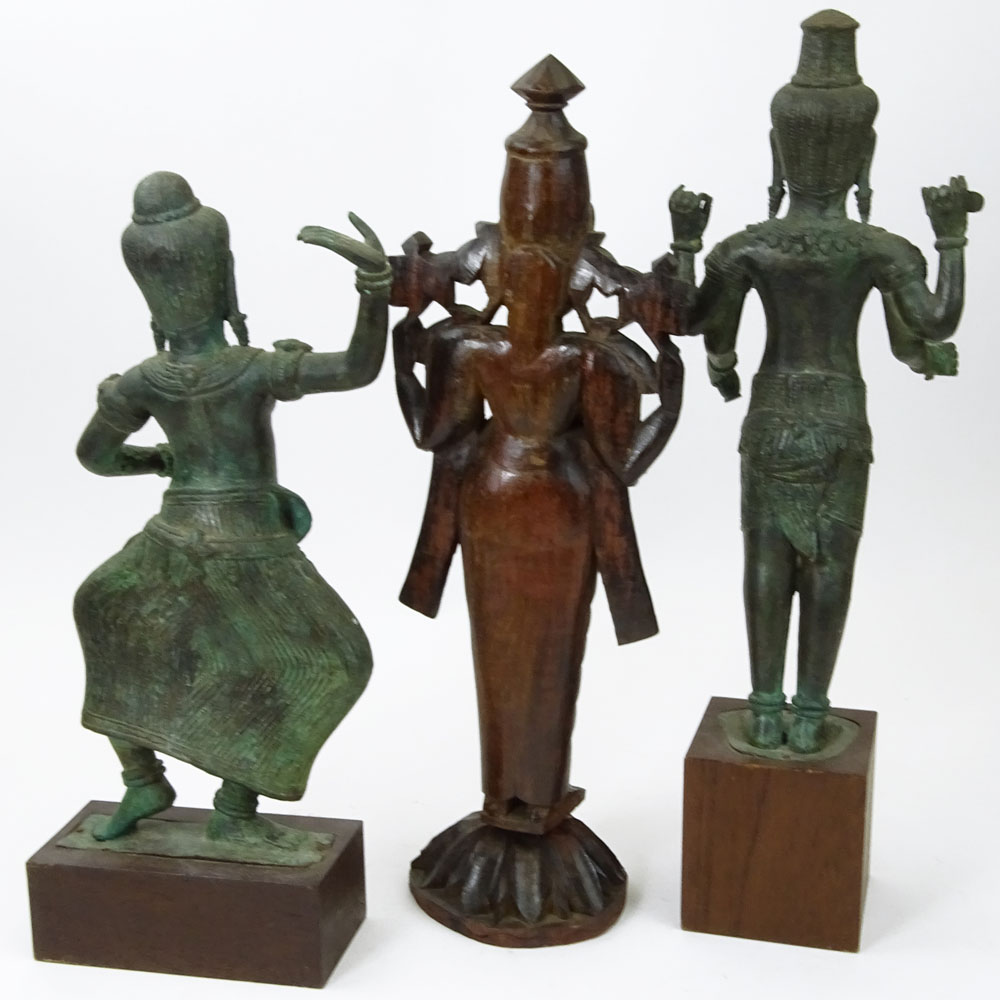 Pair of Modern Tibetan Style Cast Metal Figures on Wood Stands Together with a Carved Wood Figurine.