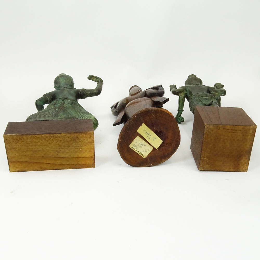 Pair of Modern Tibetan Style Cast Metal Figures on Wood Stands Together with a Carved Wood Figurine.